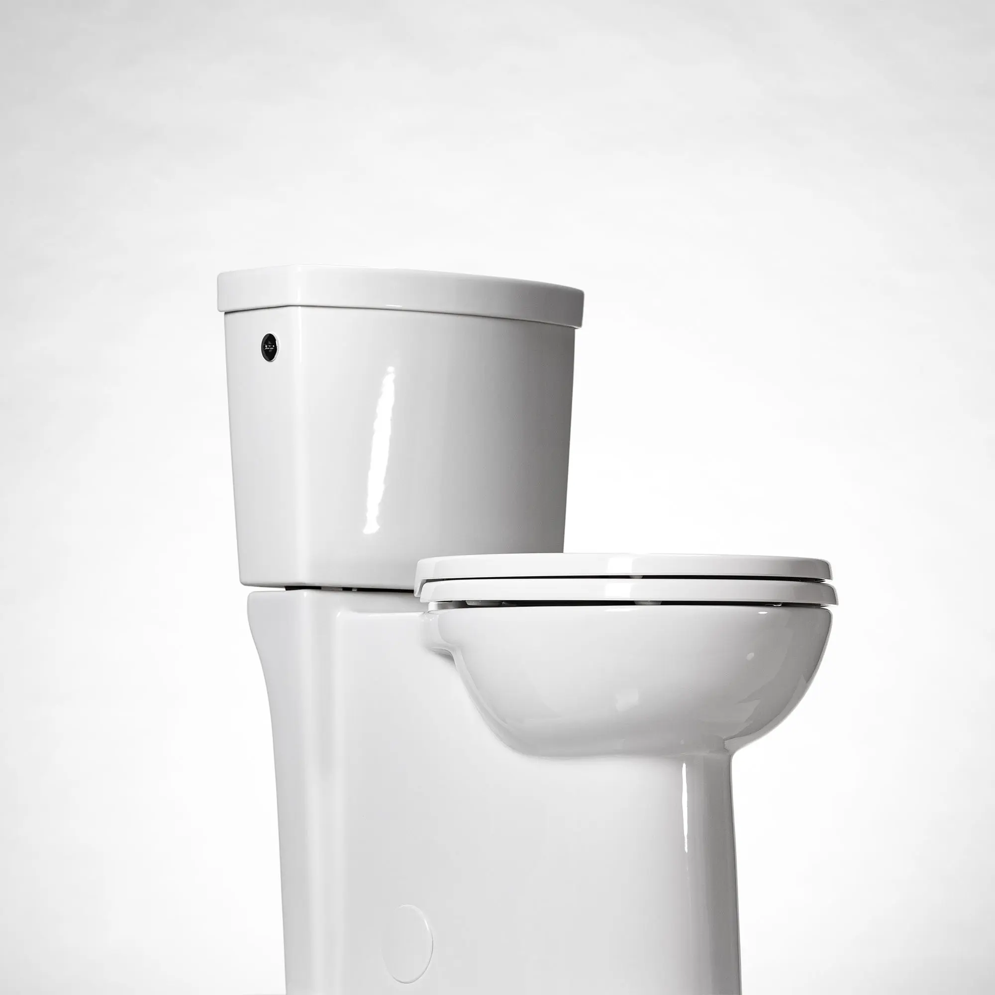 Studio Touchless Skirted Two-Piece 1.28 gpf/4.8 Lpf Chair Height Elongated Toilet with Seat