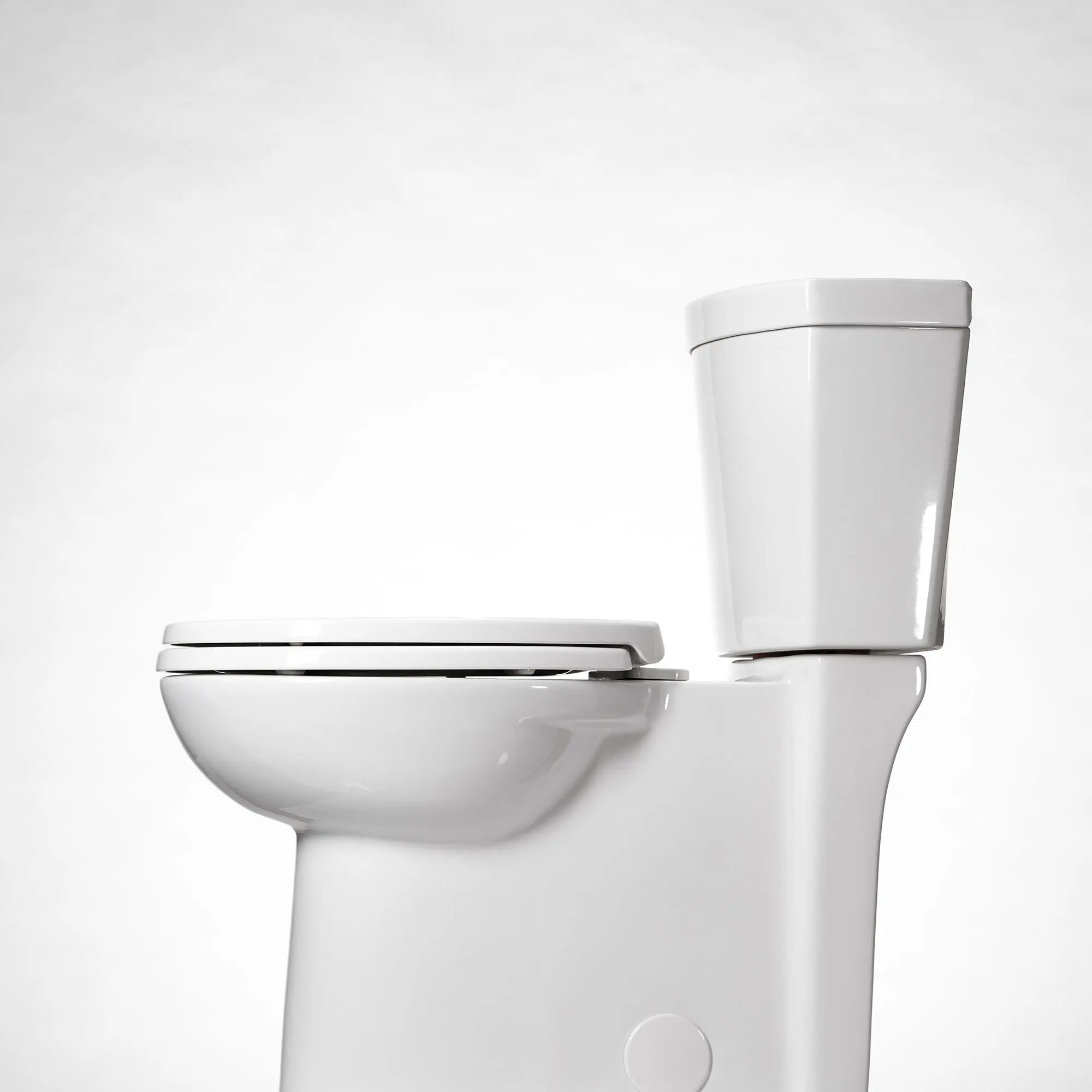 Studio Touchless Skirted Two-Piece 1.28 gpf/4.8 Lpf Chair Height Elongated Toilet with Seat